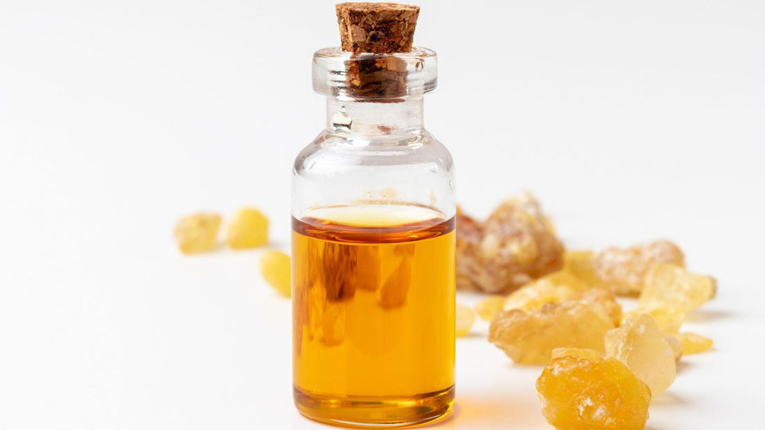 Frankincense sitting behind a bottle of frankincense essential oil