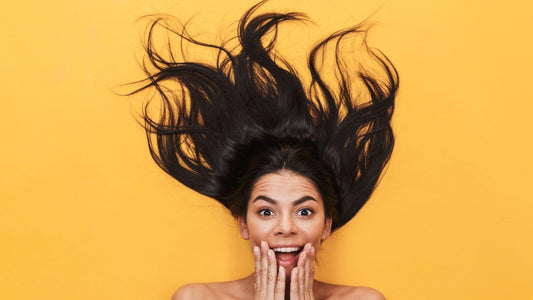 Woman laying on floor with excited expression 