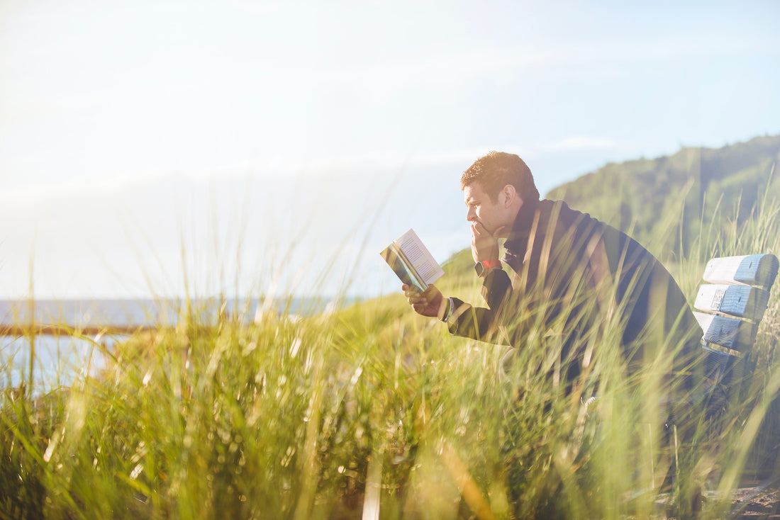 man using essential oils for memory and focus as he reads