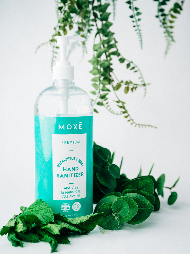 Person Using MOXĒ Eucalyptus Mint Hand Sanitizer