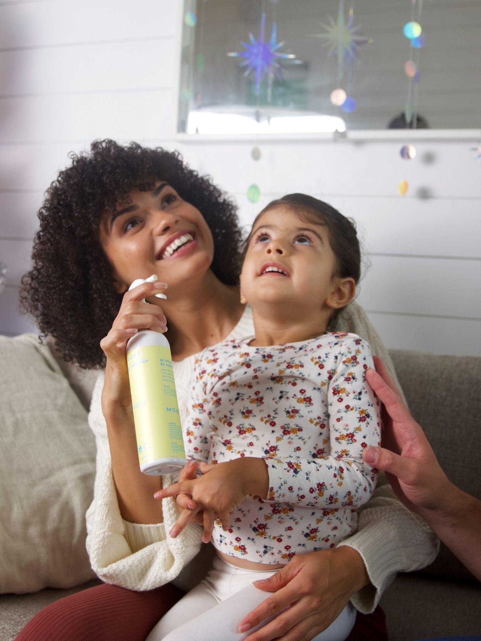 Mother and Daughter Smiling After Using MOXĒ  Happy Room + Linen Spray