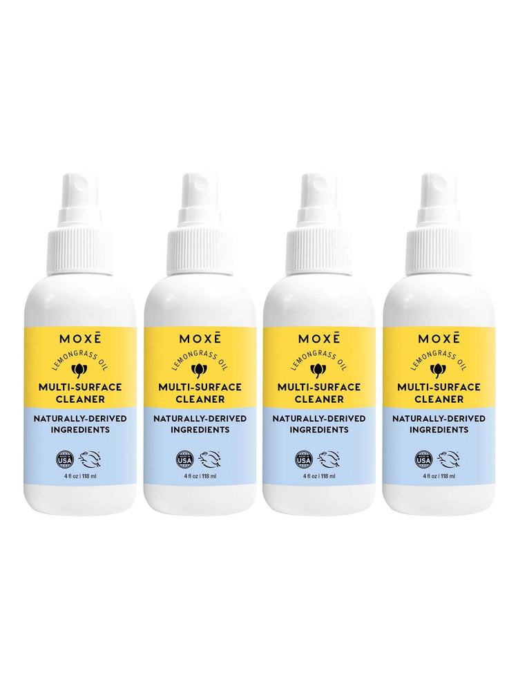 Girl Cleaning Her Kitchen With MOXĒ  Lemongrass Oil Multi-Surface Cleaner