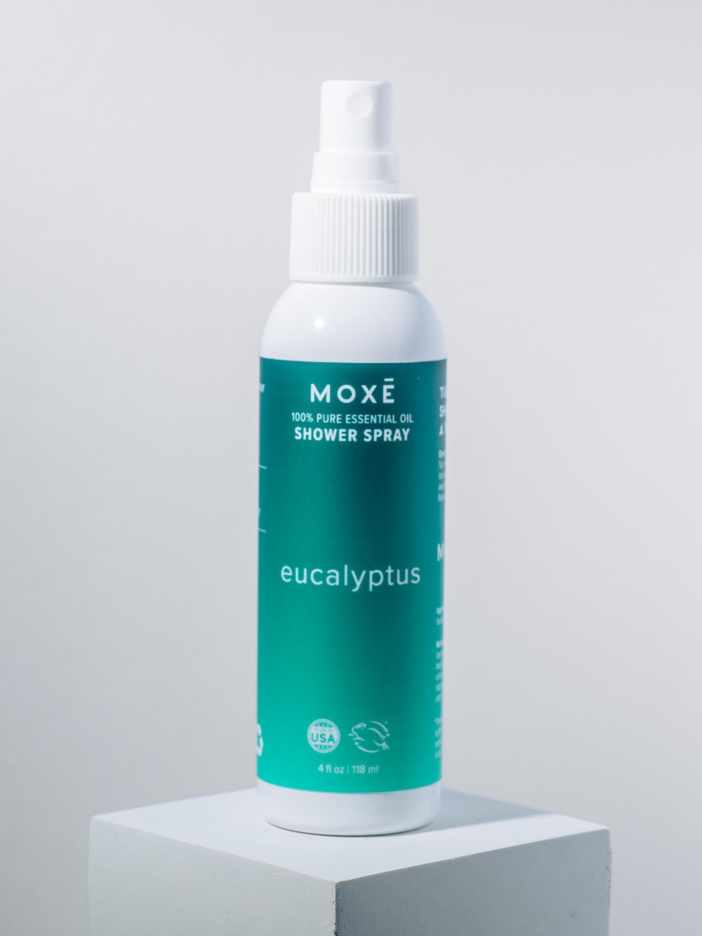 White bottle MOXĒ Eucalyptus Shower Spray with green label - View 1