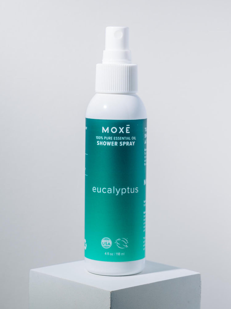 
                
                    Load image into Gallery viewer, White bottle MOXĒ Eucalyptus Shower Spray with green label - View 1
                
            
